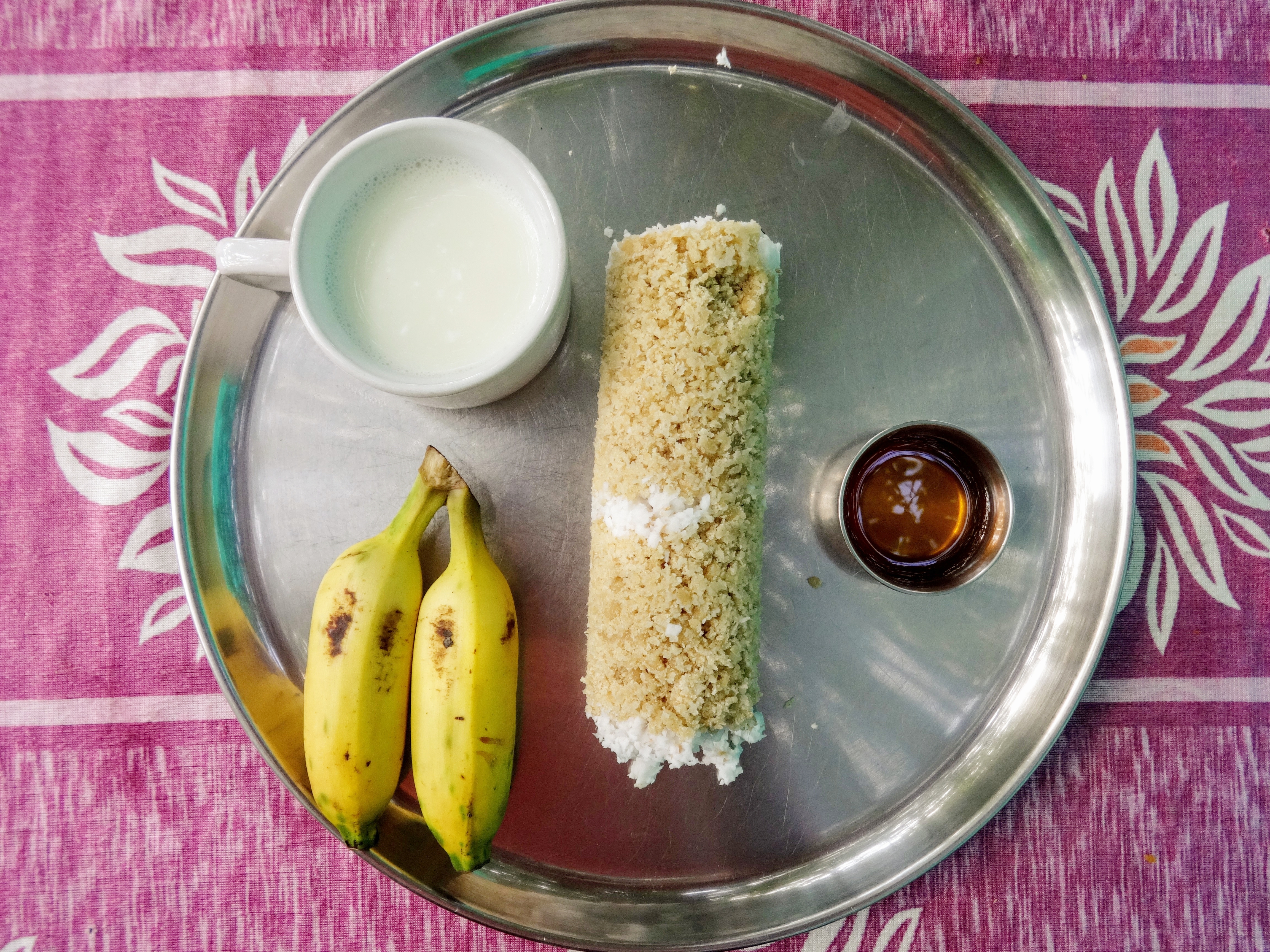 Wheat coconut puttu, bananas, milk and honey